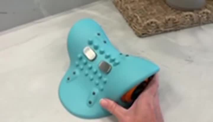 Customer using the Cervya neck massager