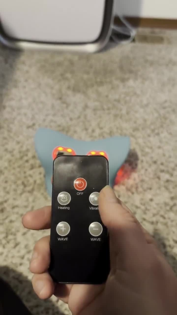 Customer using the Cervya neck massager